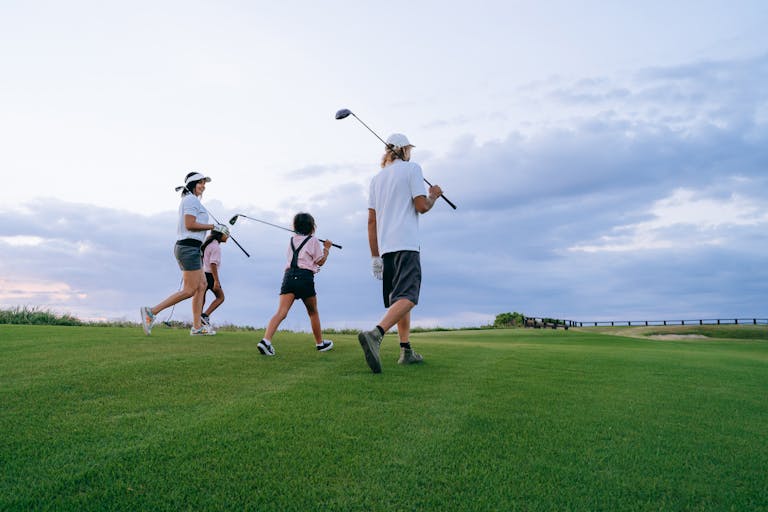 family playing golf